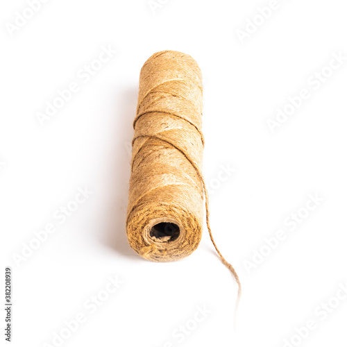 flax rope. Twine made from natural raw materials. On white background. Close-up.