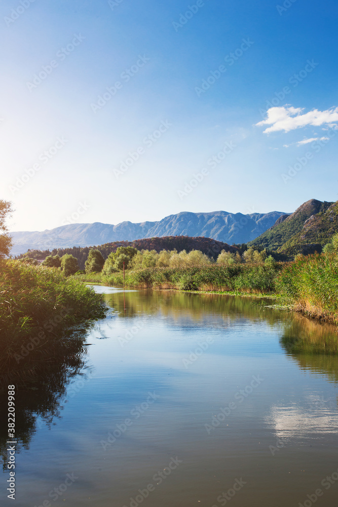Lake and mountains in an ecological reserve - nature park with fishing
