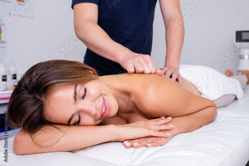 Relaxed woman receiving a massage.