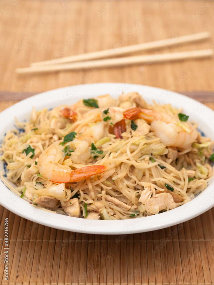 Stir-fried noodles with shrimp, chicken and vegetables Stir-fried noodles with shrimp, chicken and vegetables