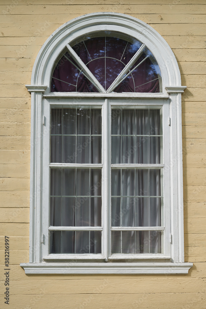 Old wooden window on the facade of the building
