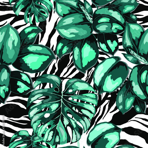 Tropical seamless pattern on animalistic texture. Jungle exotic summer print. Summer tropical leaf. Tropical flower fashion pattern. Floral tropic illustration. Vector seamless pattern.