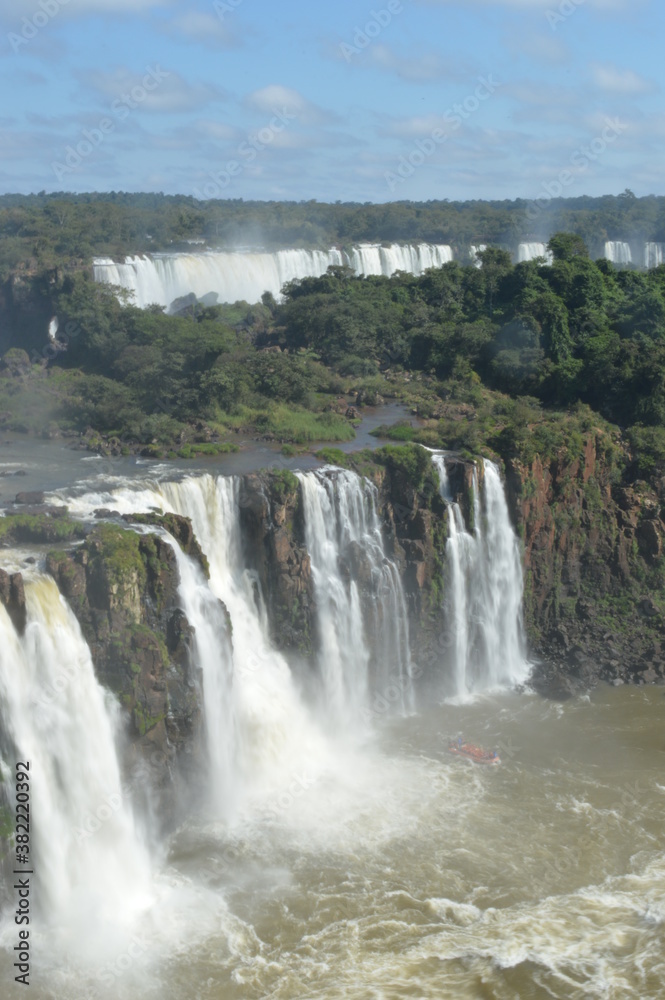 Rainbows over the mighty and powerful Iguzu (Iguacu) Waterfalls between Brazil and Argentina Rainbows over the mighty and powerful Iguzu (Iguacu) Waterfalls between Brazil and Argentina