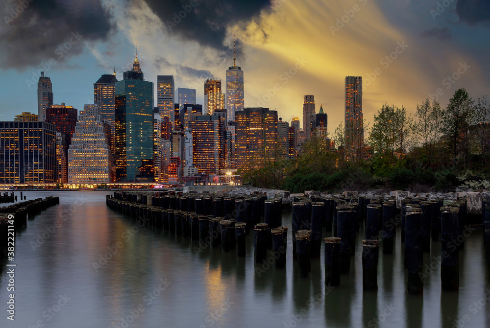 New York City with Manhattan downtown skyline over East River during sunset
