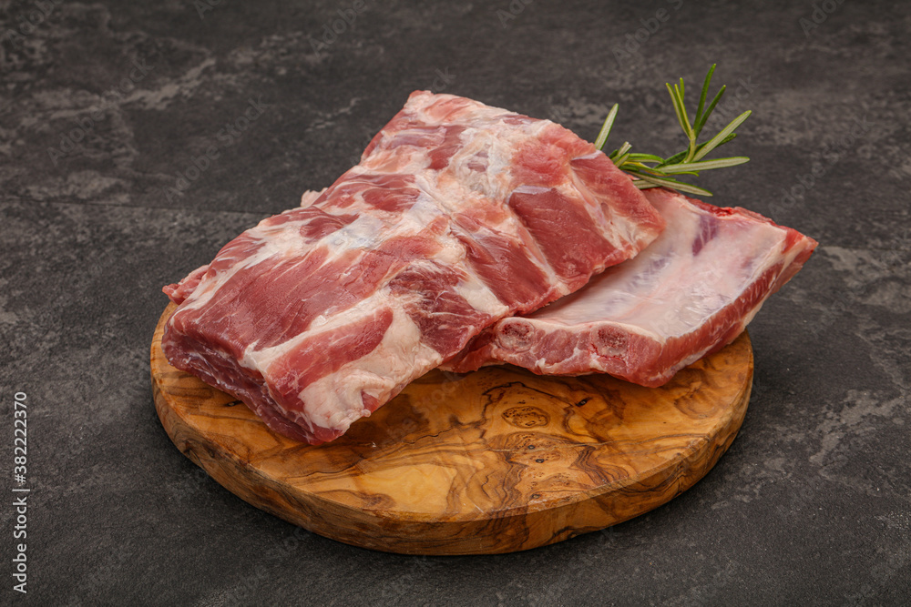 Raw pork ribs served rosemary Raw pork ribs served rosemary