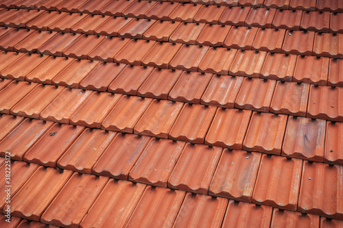 Old red tile in-line roof pattern on the house and buildings
