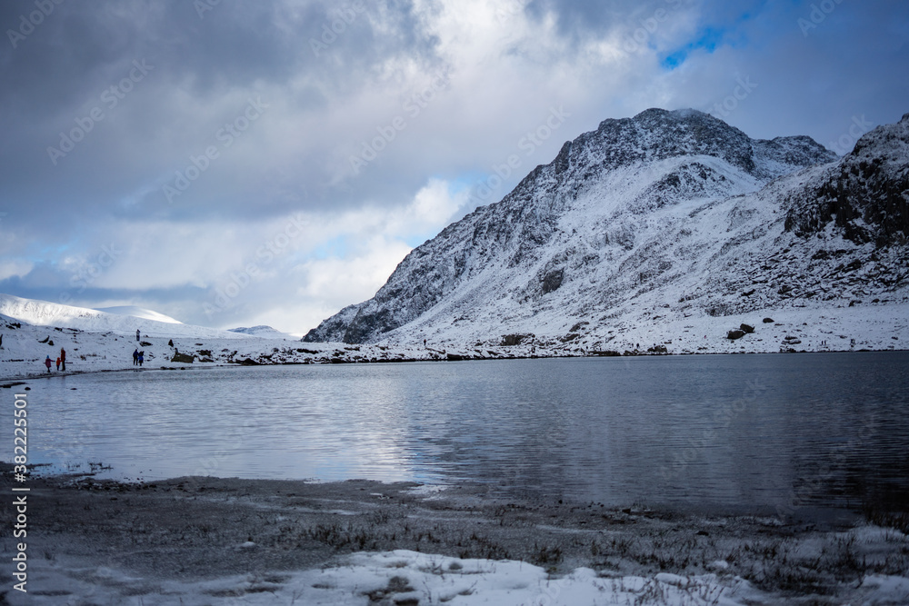 Llyn Idwal and snow on the Tryfan in background, Snowdonia National Park during winter, Wales, UK Llyn Idwal and snow on the Tryfan in background, Snowdonia National Park during winter, Wales, UK