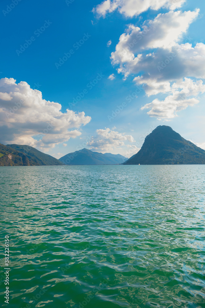 Beautiful landscape, wavy water of the lake and mountains on the horizon