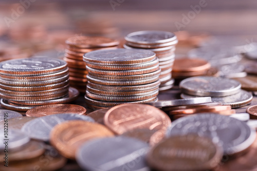 American coins and US dollars on a wooden table