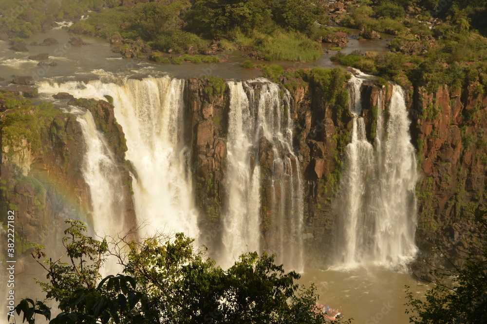 Naklejka premium The powerful and mighty Iguazu (Iguacu) Waterfalls between Brazil and Argentina