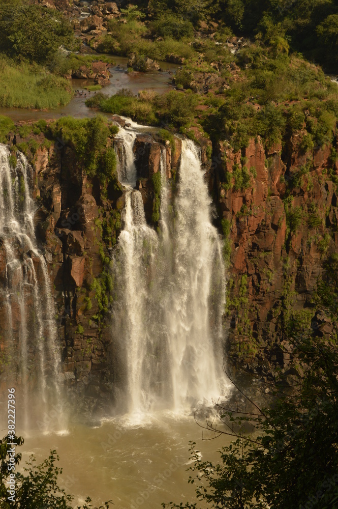 Obraz premium The powerful and mighty Iguazu (Iguacu) Waterfalls between Brazil and Argentina