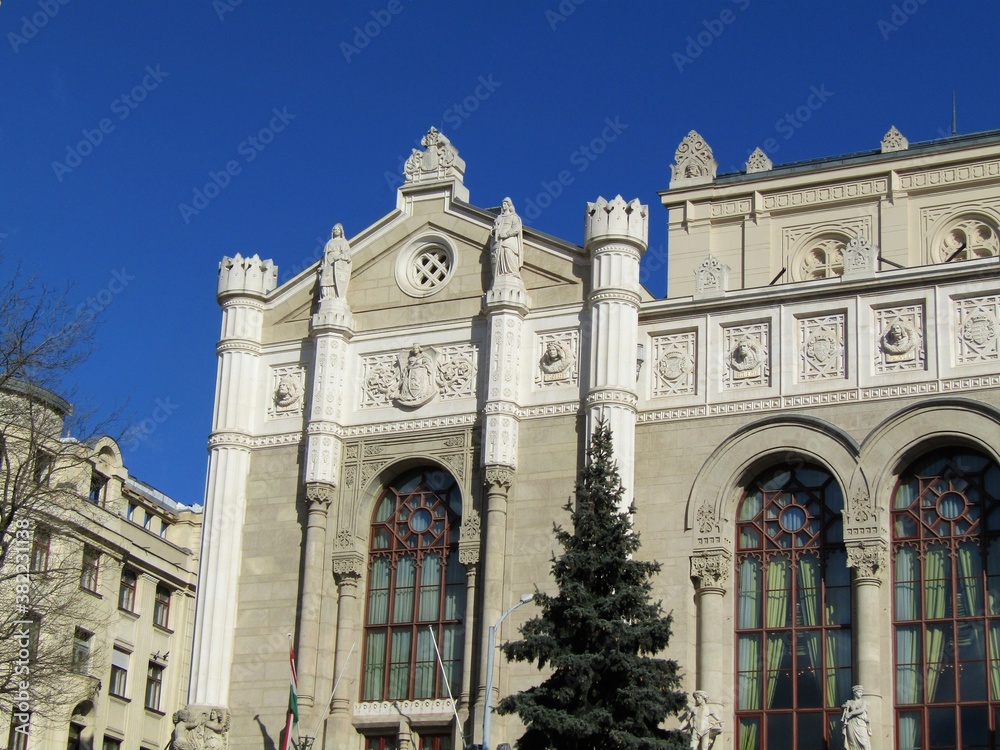 Amazing old ornate ancient white theatre building detail with large storied windows in winter in Budapest, Hungary