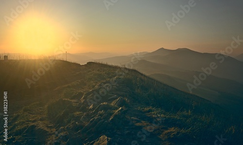 Fototapeta Naklejka Na Ścianę i Meble -  Sunrise in the Bieszczady Mountains illuminating the rocky mountain slope
