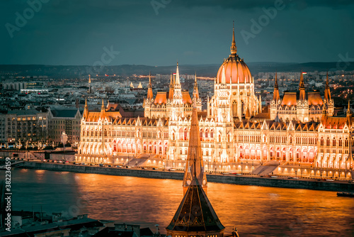 View over the Danube River of the Hungarian Parliament at night. Budapest, Hungary