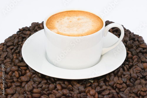 Black coffee on a background of beans