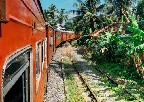 Scenery railway road from Colombo to Matara. The train goes by jungles, local villages.. Sri Lanka, December 2017