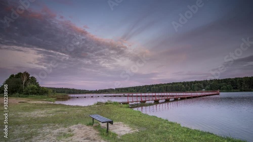 Wallpaper Mural Time lapse of a smooth lake during sunset mirroring the forest surrounding it. Beautiful sky changes during sunset showing all the colours. Torontodigital.ca
