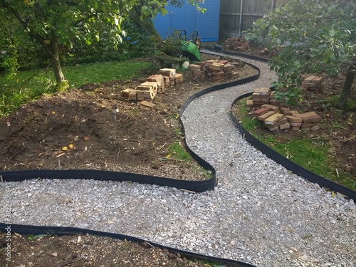 Fotografia Landscape of garden design project building constructing a winding path with ant