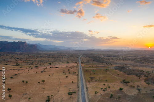 Empty road across the arid landscape, aerial view by drone, Gheralta Mountains, Hawzen, Tigray Region, Ethiopia photo