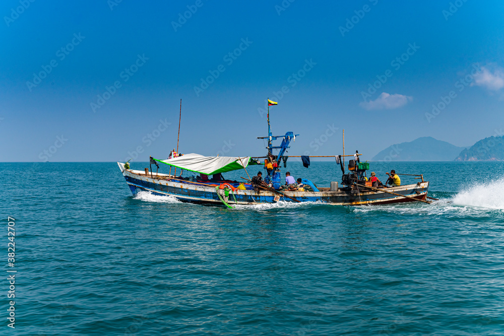 Sea gypsies Moken on their fishing boat, Mergui (Myeik) Archipelago Sea gypsies Moken on their fishing boat, Mergui (Myeik) Archipelago