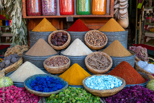 Display of spices and pot pourri in spice market in the souks of Marrakech, Morocco photo