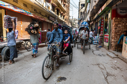 Rickshaw drivers in the bazaar, Dhaka photo