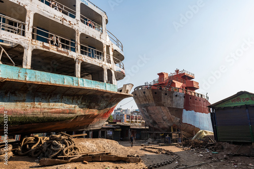 Ships being broken up in the shipwreck cemetery (ship breaking yard), Port of Dhaka photo