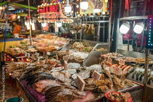 Fresh seafood for sale in Bukit Bintang food street at night in the capital city of Kuala Lumpur, Malaysia photo