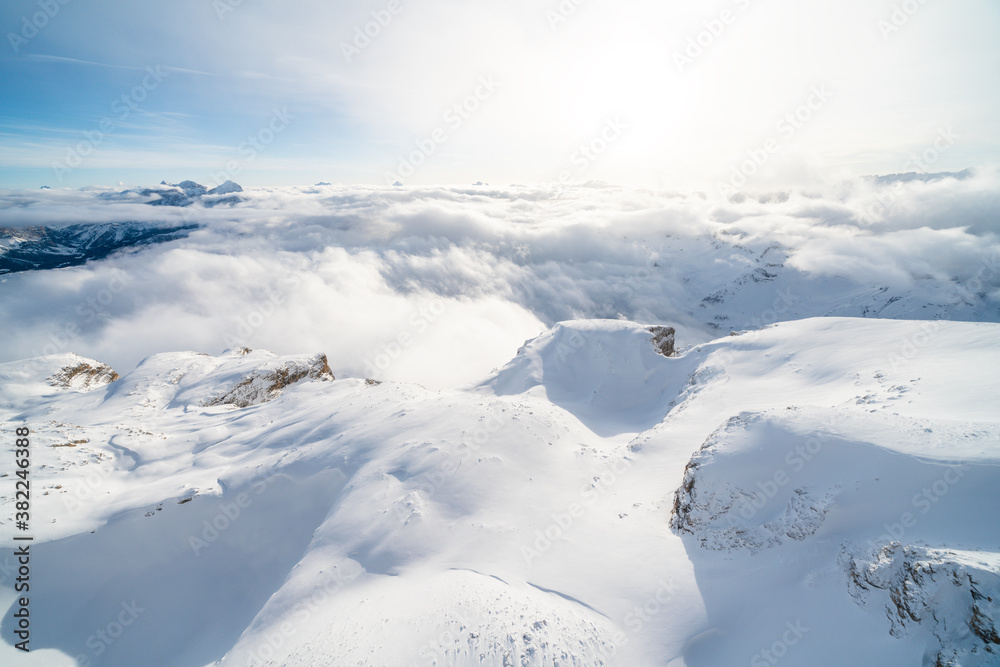 Aerial view of Sass Pordoi covered with snow, Sella group, Dolomites, Trentino-Alto Adige Aerial view of Sass Pordoi covered with snow, Sella group, Dolomites, Trentino-Alto Adige