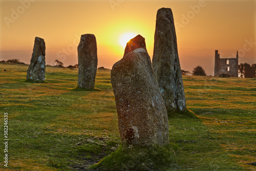 Sunrise over standing stones at the Hurlers, a series of prehistoric stone circles on Bodmin Moor, near Liskeard, east Cornwall photo
