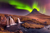 Aurora Borealis (Northern Lights) over Kirkjufell Mountian with a small waterfall in Iceland, Polar Regions