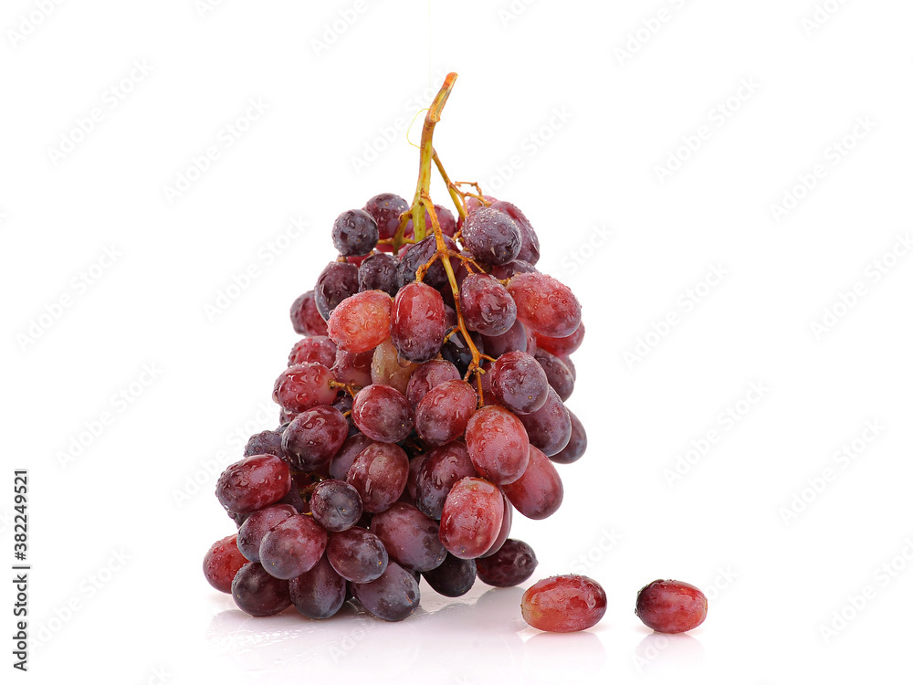 Obraz premium Bunch of Grapes on white reflective background. Isolated