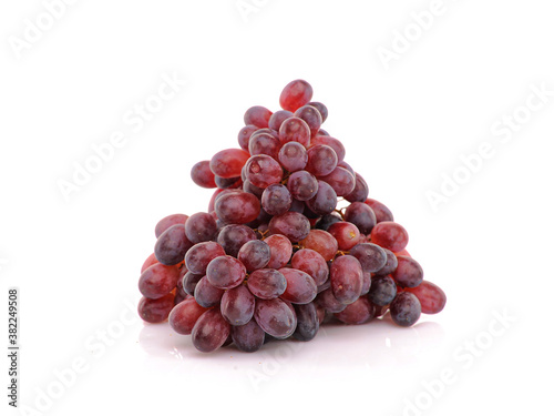 Bunch of Grapes on white reflective background. Isolated