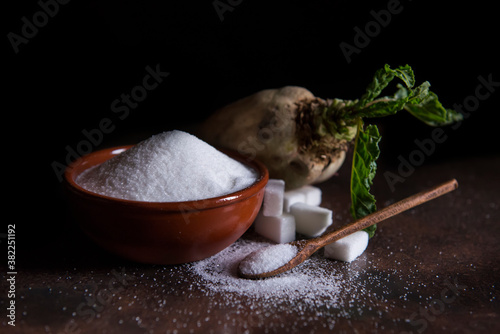sugar beet and white sugar with rust background