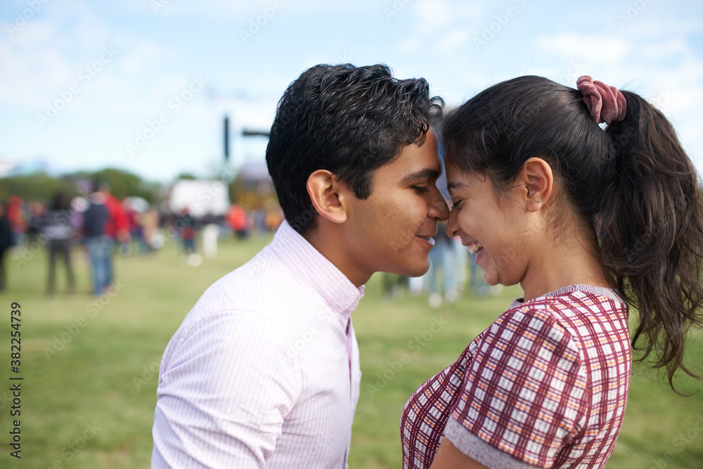 Young couple in love at a festival Young couple in love at a festival