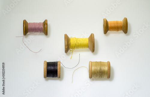 multi-colored threads on old coils