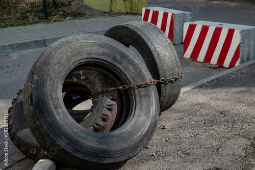 worn old tires as a barrier to obstruct traffic © Zinoviy