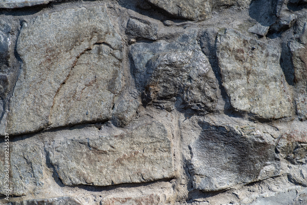 Fototapeta premium the texture of the old wall from stones as background