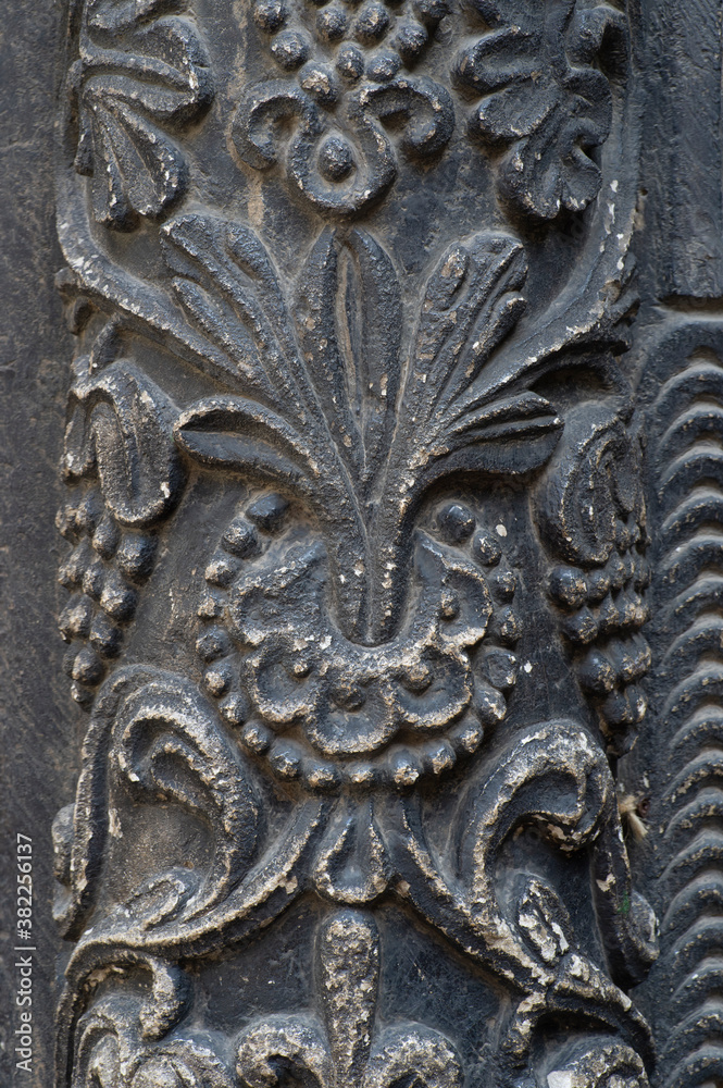 the decorative ornament on the stone of the old building