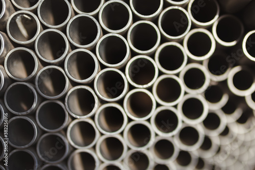 A group of metal pipes together. Top view  shallow depth of field.