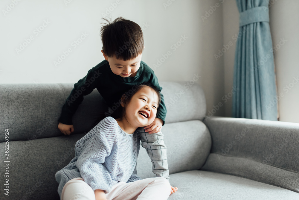 Cute toddler girl and boy playing at home Cute toddler girl and boy playing at home