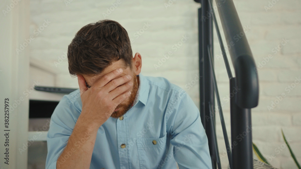 Worried businessman working with smartphone and documents on sofa holds papers sad phone smartphone internet cell attractive slow motion Worried businessman working with smartphone and documents on sofa holds papers sad phone smartphone internet cell attractive slow motion