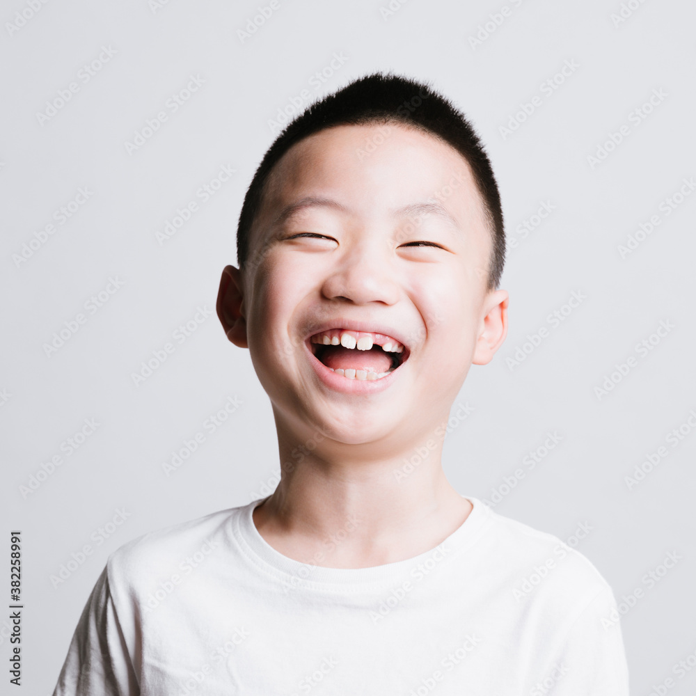 portrait of cute asian boy laughing portrait of cute asian boy laughing