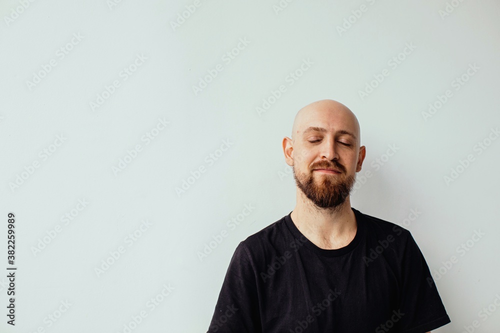 Glad bald man with closed eyes Glad bald man with closed eyes