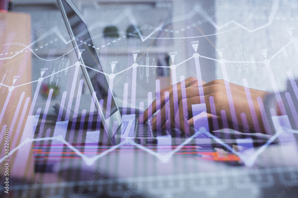 Double exposure of woman hands typing on computer and forex chart hologram drawing. Stock market invest concept. Double exposure of woman hands typing on computer and forex chart hologram drawing. Stock market invest concept.