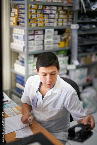 Medical professional in a medicine supply room photo