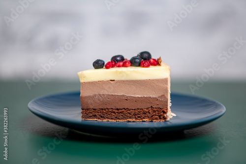 chocolate cake with strawberry and pomegranate seeds