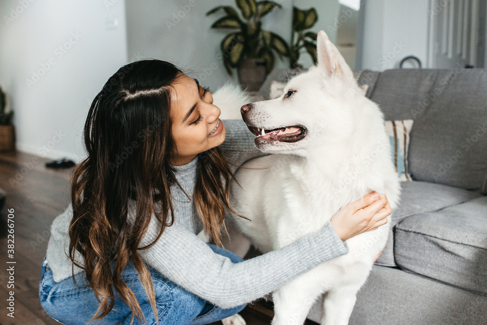 A woman & her all white Akita dog. A woman & her all white Akita dog.