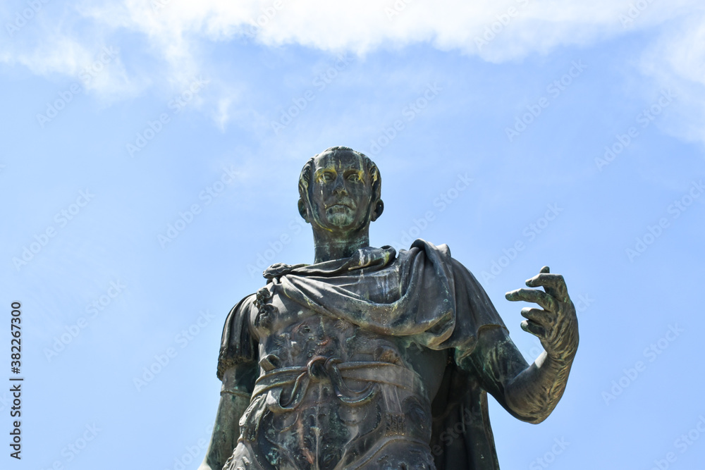 Detail of the bronze statue of the Roman emperor Julius Caesar in Via Dei Fori Imperiali in the center of Rome.