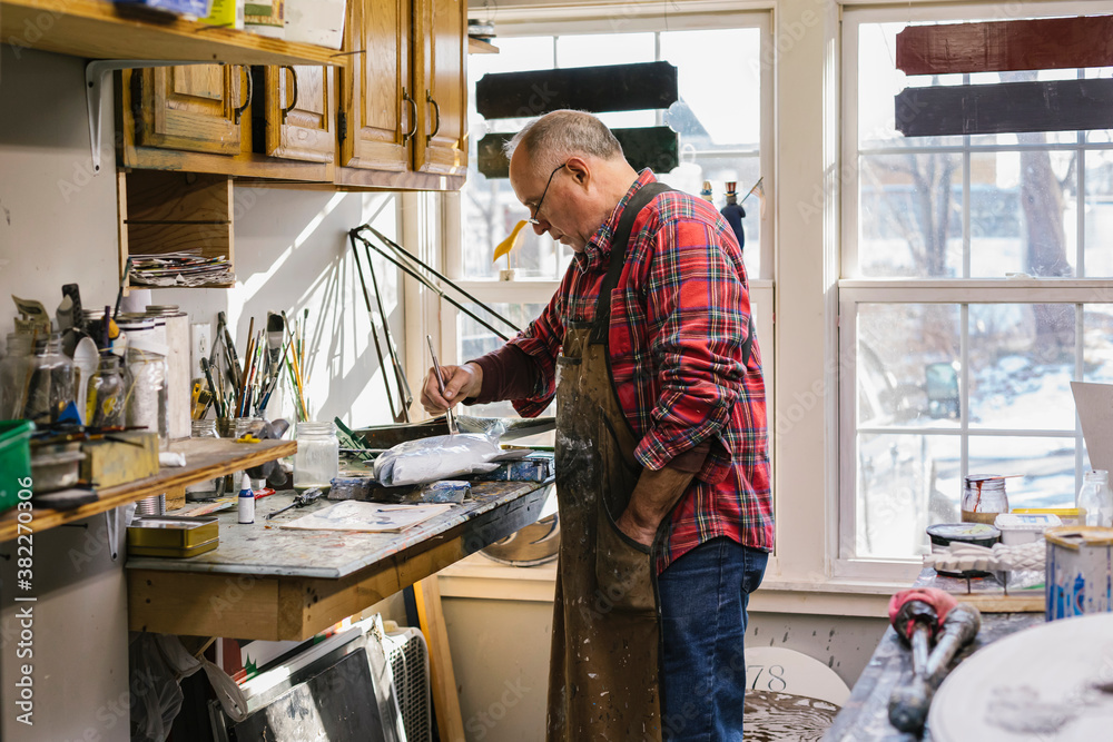 Woodworker at His workshop in Small town